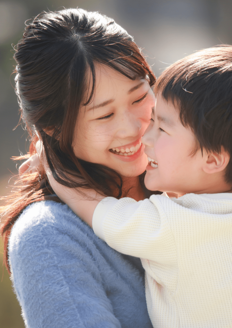 Mother and son smiling